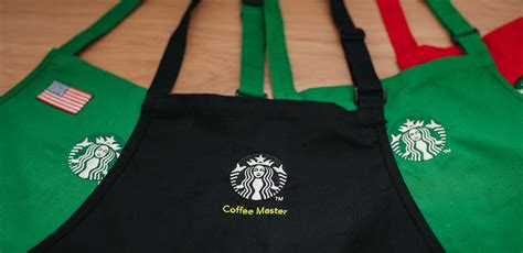 The coveted Starbucks Coffee Master black aprons .